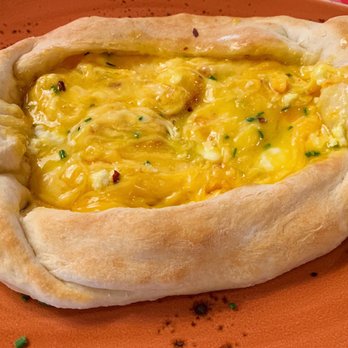 Hazel's - Georgian cheese bread: raw egg yolk was cooked at the table inside the hot melted cheese, along with 1/2 stick of butter - Bars Near Me - Birmingham, Michigan
