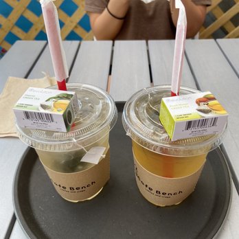 Cafe Bench - Iced Tea (organic green tea on left & peach mango green tea on right) - Cafes Near Me - Flushing, New York Cafe Bench - Iced Tea (organic green tea on left & peach mango green tea on right) - Cafes Near Me - Flushing, New York