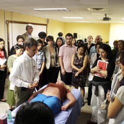 East-West Integrated Wellness - Dr. Paul F. Ryan teaching abdominal acupuncture at the Pacific College of Health Sciences in 2016.
