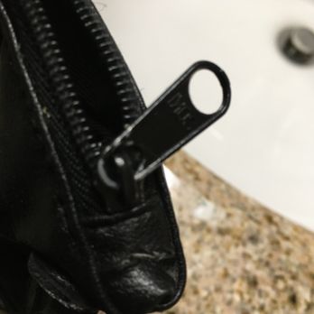 Aviation Shoe Repair - Looks like they chewed the zipper tab. Which was not scuffed prior. You can see where he hacked the leather, then attempted to conceal it? - Shoe Repair Near Me - Redondo Beach, California Aviation Shoe Repair - Looks like they chewed the zipper tab. Which was not scuffed prior. You can see where he hacked the leather, then attempted to conceal it? - Shoe Repair Near Me - Redondo Beach, California
