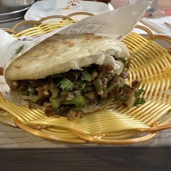 Bun World - Chinese Hamburger, inside is seasoned diced pork belly pan fried till crispy. Mix in some grilled onions and Jalapeños. - Chinese Near Me - Anaheim, California Bun World - Chinese Hamburger, inside is seasoned diced pork belly pan fried till crispy. Mix in some grilled onions and Jalapeños. - Chinese Near Me - Anaheim, California
