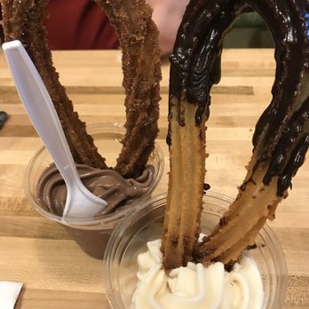 DULCE Churro Cafe - Looped churro with chocolate and Bavarian cream On the side with vanilla and chocolate ice cream - Desserts Near Me - Gilbert, Arizona DULCE Churro Cafe - Looped churro with chocolate and Bavarian cream On the side with vanilla and chocolate ice cream - Desserts Near Me - Gilbert, Arizona