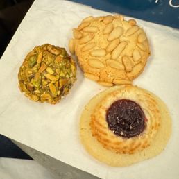 Pistachio cookie, pignoli cookie, and one with jam and almond paste- all must orders!