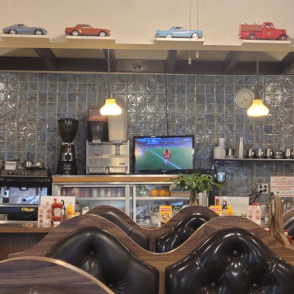 Salonica - Counter with tv, model cars, and booths in the foreground. - Diners Near Me - Chicago, Illinois Salonica - Counter with tv, model cars, and booths in the foreground. - Diners Near Me - Chicago, Illinois