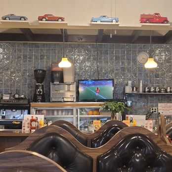 Salonica - Counter with tv, model cars, and booths in the foreground. - Diners Near Me - Chicago, Illinois Salonica - Counter with tv, model cars, and booths in the foreground. - Diners Near Me - Chicago, Illinois