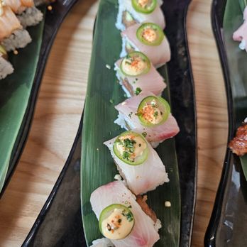 Shimogamo - Hamachi Lime Roll yellowtail / spicy tuna/ cucumber / spicy mayo sauce / lemon oil/ chives shichimi lime/ serrano / chives - Japanese Near Me - Gilbert, Arizona Shimogamo - Hamachi Lime Roll yellowtail / spicy tuna/ cucumber / spicy mayo sauce / lemon oil/ chives shichimi lime/ serrano / chives - Japanese Near Me - Gilbert, Arizona