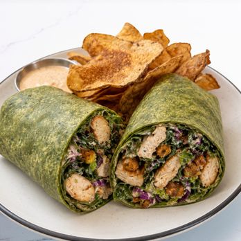Dish Society - NEW CHICKEN CAESAR WRAP
Grilled chicken, Tuscan kale, romaine, cabbage, spiced chickpeas, Parmesan, & Caesar dressing in a spinach tortilla - Southern Near Me - Austin, Texas Dish Society - NEW CHICKEN CAESAR WRAP
Grilled chicken, Tuscan kale, romaine, cabbage, spiced chickpeas, Parmesan, & Caesar dressing in a spinach tortilla - Southern Near Me - Austin, Texas