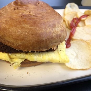 Elevate Breakfast Company - Livermush Egg and Cheese Breakfast Sandwich on croissant with home fries. - Breakfast & Brunch Near Me - Marion, North Carolina