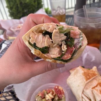 Side Street Diner - a hand holding a burrito - Diners Near Me - Grosse Pointe, Michigan Side Street Diner - a hand holding a burrito - Diners Near Me - Grosse Pointe, Michigan