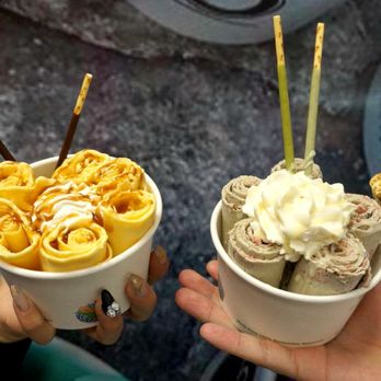 Rollies - a person holding two cups of food - Ice Cream & Frozen Yogurt Near Me - Edmonton, Alberta Rollies - a person holding two cups of food - Ice Cream & Frozen Yogurt Near Me - Edmonton, Alberta