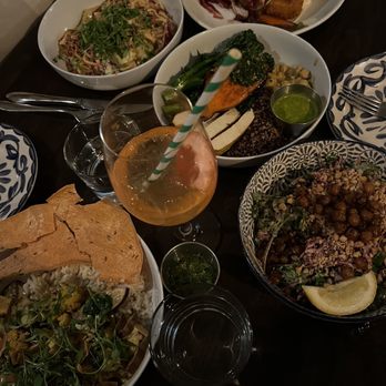 Basic Kitchen - Noodle bowl (back left), Breaded Cauliflower steak (back right), Basic Bowl, Tofu Golden Curry, Kale Caesar, Aperol Spritz - New American Near Me - Charleston, South Carolina