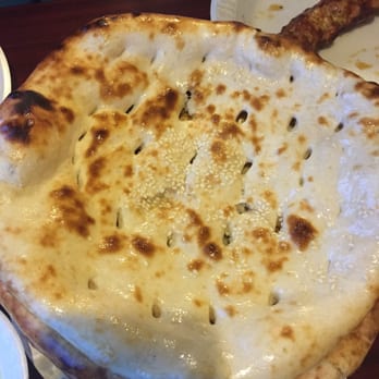 New Punjab - a plate of food and a pizza on a table - Pakistani Near Me - Upper Darby, Pennsylvania New Punjab - a plate of food and a pizza on a table - Pakistani Near Me - Upper Darby, Pennsylvania