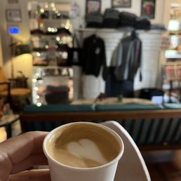 a person holding a cup of coffee a person holding a cup of coffee