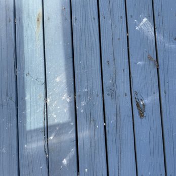 Northwest Exteriors - Just a portion of my deck covered in caulking, the entire deck was like this - Windows Installation Near Me - Santa Rosa, California