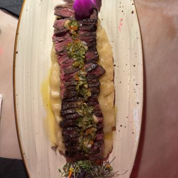 Isla Caribbean Cuisine - D- CHURRASCO CON CHIMICHURRI, ACOMPANADO DE UN MAJADO DE YUCA Y AJO ASADO - Caribbean Near Me - Syracuse, New York Isla Caribbean Cuisine - D- CHURRASCO CON CHIMICHURRI, ACOMPANADO DE UN MAJADO DE YUCA Y AJO ASADO - Caribbean Near Me - Syracuse, New York
