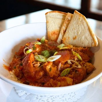 Symposium Cafe Restaurant Aurora - Butter chicken with pita bread - Breakfast & Brunch Near Me - Aurora, Ontario Symposium Cafe Restaurant Aurora - Butter chicken with pita bread - Breakfast & Brunch Near Me - Aurora, Ontario