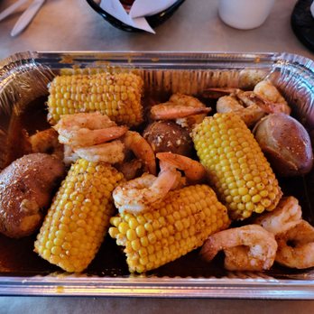 Outcast Seafood - 1lb Shrimp tray w/an extra side of potatoes and an extra side of corn. - Seafood Near Me - Miramar Beach, Florida Outcast Seafood - 1lb Shrimp tray w/an extra side of potatoes and an extra side of corn. - Seafood Near Me - Miramar Beach, Florida