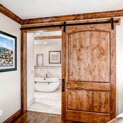 Goldberg Brothers - Goldberg Brothers barn door hardware looks great on a master bathroom door.