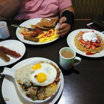 Broken Yolk Cafe - American breakfast and a country skillet with a Belgian waffle topped with strawberries for desert. I love coming here! - Breakfast & Brunch Near Me - Orange, California