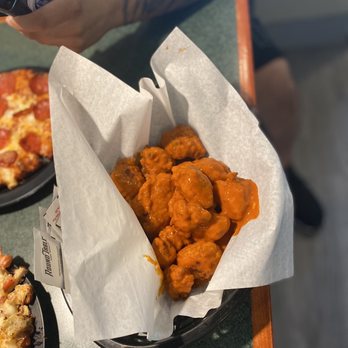 Round Table Pizza - a person taking a picture of their food - Pizza Near Me - Encinitas, California Round Table Pizza - a person taking a picture of their food - Pizza Near Me - Encinitas, California