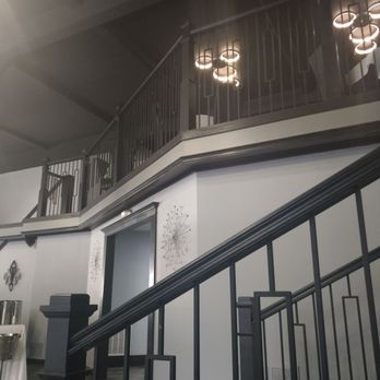 The Chop House On Main - a staircase and railing - Steakhouses Near Me - Jamestown, New York