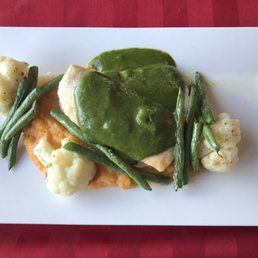 Haddock loin garnished with spinach velouté sauce, mashed sweet potato and sautéed fresh vegetables.