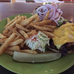 Bacon burger with pile of fries Bacon burger with pile of fries
