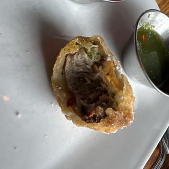 The Flying Goat - Inside of the Roskelley Dumplings, sausage with fennel and cheese. - Gastropubs Near Me - Spokane, Washington