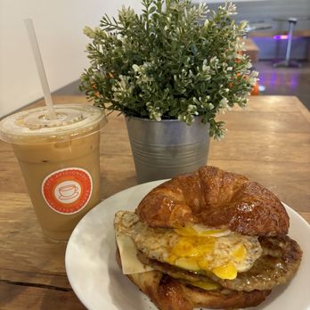 Cafe Aficionado - Cold brew and croissant breakfast sandwich! Delicious! Will come back again! - Coffee & Tea Near Me - Los Angeles, California