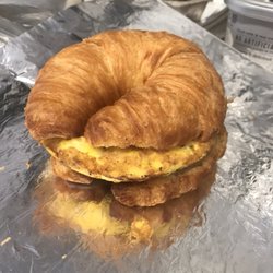 Common Grounds - Gourmet Brunchwich Croissant. 2 eggs, hash browns, choice of meat, cheese, mushrooms & onions, all cooked in butter and garlic.
