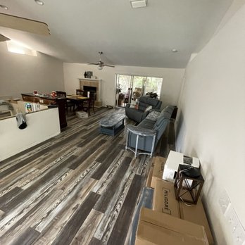 A1 Floors - a living room with a lot of furniture - Flooring Near Me