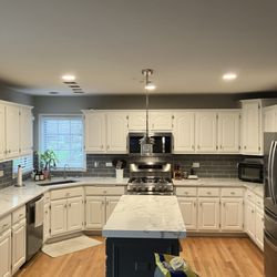 Beyond Epic Electric - Added can lights and moved fixture over island