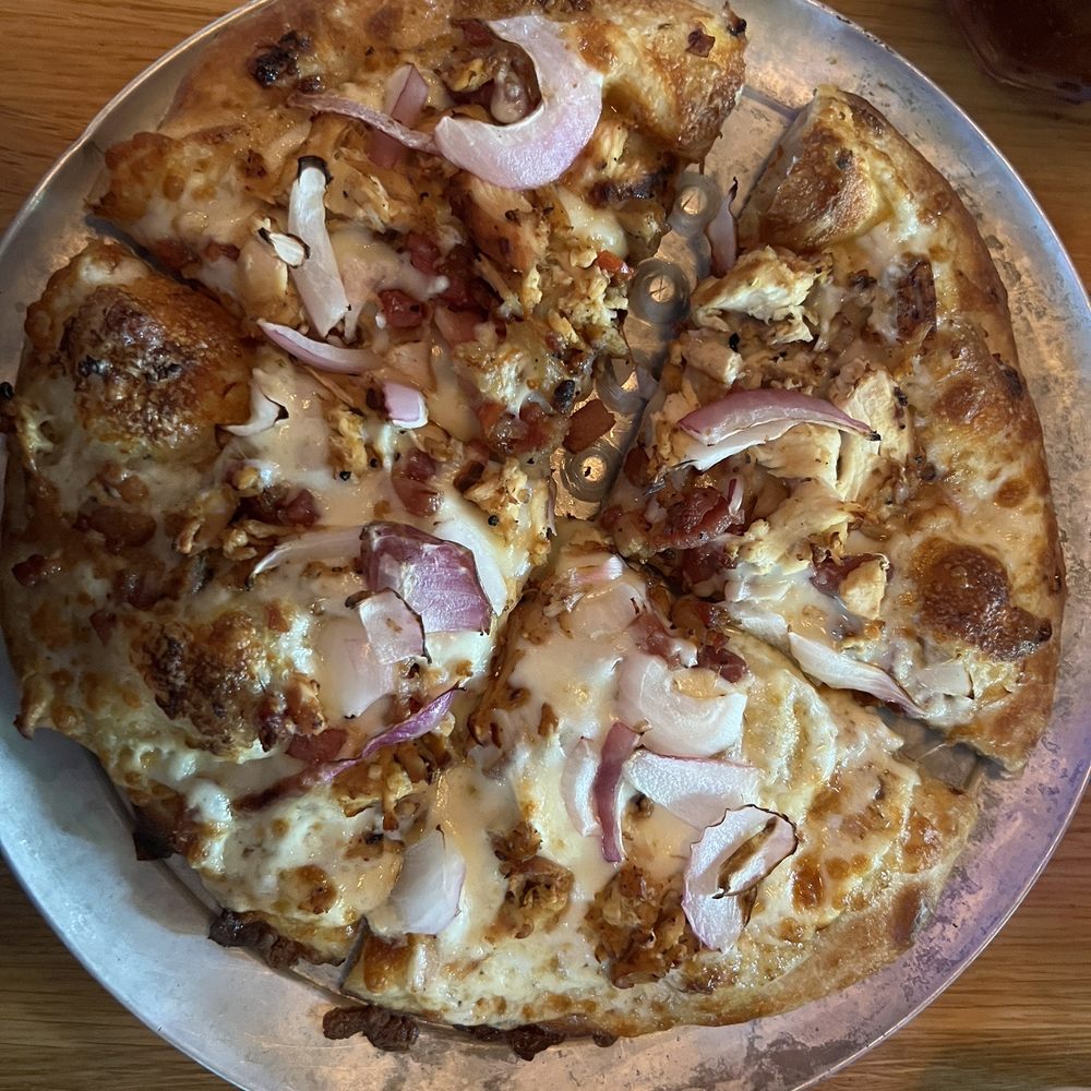 Old Chicago Pizza + Taproom - Hand tossed personal chicken, bacon, onion mozzarella pizza with garlic cream sauce. - Pizza Near Me - Columbia, South Carolina Old Chicago Pizza + Taproom - Hand tossed personal chicken, bacon, onion mozzarella pizza with garlic cream sauce. - Pizza Near Me - Columbia, South Carolina