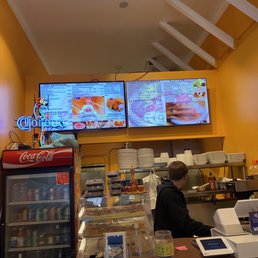 a man ordering food at the counter