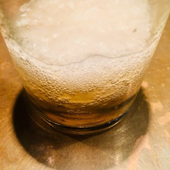Uchi Houston - Sapporo light. Glass so cold it froze my beer just right :) - Sushi Bars Near Me - Houston, Texas
