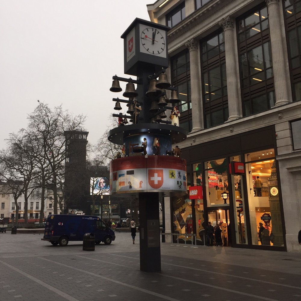 Leicester Square - Loud display at the noon hour from this chiming clock. - Landmarks & Historical Buildings Near Me