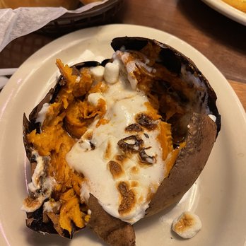 Texas Roadhouse - Loaded sweet potato after digging in - Barbeque Near Me - San Antonio, Texas