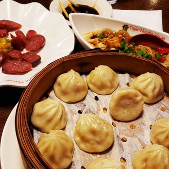 Tiger Noodle House - Chicken soup Dumplings (xiao long bao), spicy wontons, and complementary Chinese sausage - Chinese Near Me - Katy, Texas Tiger Noodle House - Chicken soup Dumplings (xiao long bao), spicy wontons, and complementary Chinese sausage - Chinese Near Me - Katy, Texas