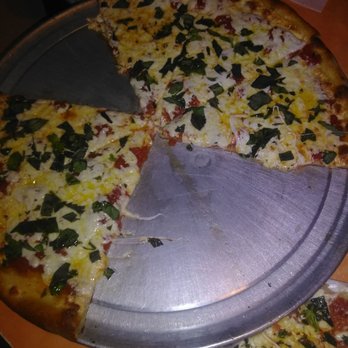 Pizza Time - The margarita pizza.  Couldn't wait for the picture.  Awesome awesome pizza - Pizza Near Me - St. Augustine, Florida