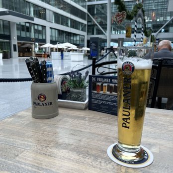 Paulaner - A kind of cool indoor Biergarten set within a busy train terminal and modern office/hotel park. - Bavarian Near Me - Frankfurt, HE Paulaner - A kind of cool indoor Biergarten set within a busy train terminal and modern office/hotel park. - Bavarian Near Me - Frankfurt, HE
