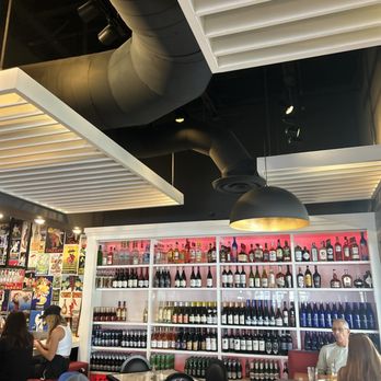 Farmhouse Kitchen - Boca Raton - Wine wall by the bar - New American Near Me - Boca Raton, Florida