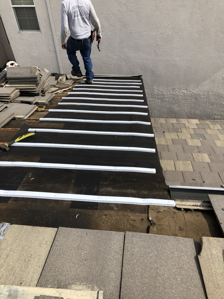 Slide of Academy Roofing