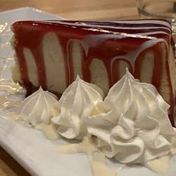 Copper Blues Bar & Grill - Cheesecake was creamy and delicious with the raspberry sauce.