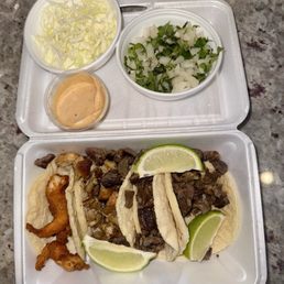A shrimp taco, chicken taco, & 2 carne asada tacos.