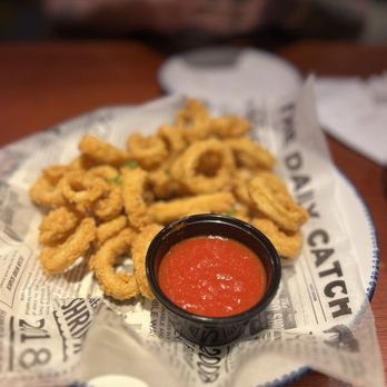 Red Lobster - a plate of deep fried squid sticks and a bowl of ketchup - Seafood Near Me - Saint Peters, Missouri Red Lobster - a plate of deep fried squid sticks and a bowl of ketchup - Seafood Near Me - Saint Peters, Missouri