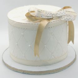 Butter Me Betty - Butter Me Betty quilted cake with ribbon.