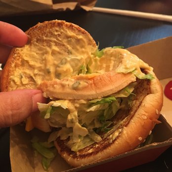 McDonald's - a hand holding a sandwich in a box - Fast Food Near Me - Miami, Florida McDonald's - a hand holding a sandwich in a box - Fast Food Near Me - Miami, Florida