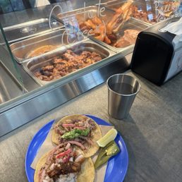 Surtida (everything) and Burriga (belly) tacos with fix-ins.