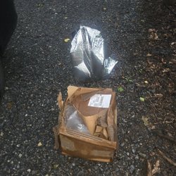 United States Post Office - The package left in the rain at the bottom of the driveway next to the mailbox on the public road.
