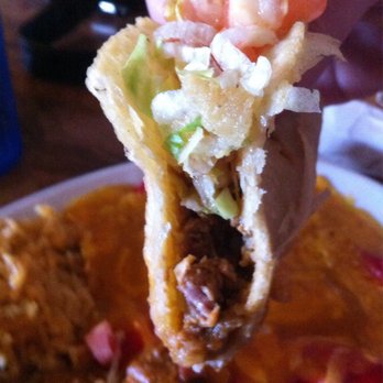 Ray's Drive Inn - Half way thru and Puffy Taco has held together... it was as good as it looks! - Tex-Mex Near Me - San Antonio, Texas